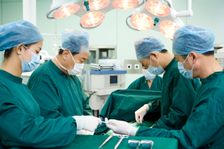 Human surgeons doing surgery